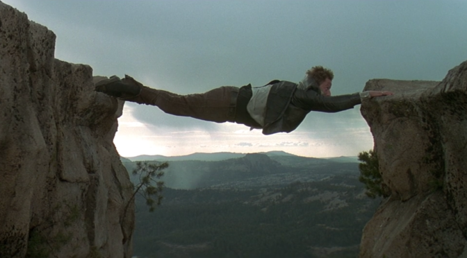 "Mad" Max Grabelski (Daniel Stern) hanging over Devil's Peak in Bushwhacked (1995)